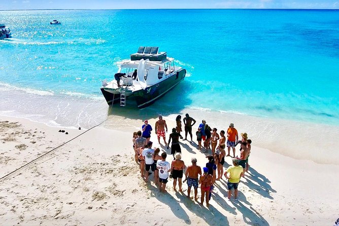 4hour Group Half Day Snorkeling Excursion in Grace Bay - Stop 3: Anchored Deeper Water, Roof Slides, and a Big Splash Moment