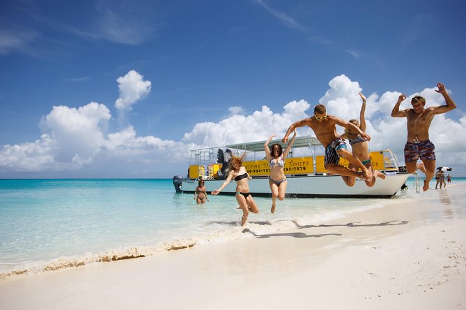 Full Day Cruise from Providenciales with Snorkeling and BBQ Lunch - Grace Bay views before you hit Leeward Reef