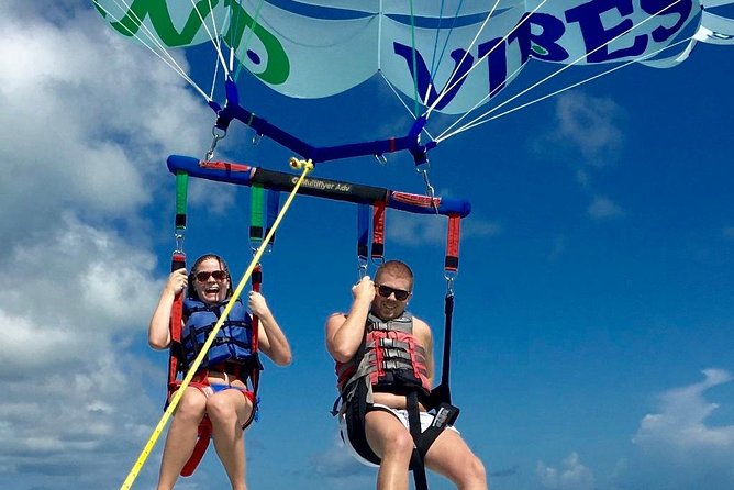 Private 4hr Parasail - Snorkel & Water-Sports Adventure, Turks and Caicos - Private charter setup: harnesses and crew attention