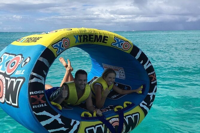 Wow Extreme Tube on Gracebay Beach Turks and Caicos Islands - Getting on the WOW Extreme Tube: the lay-down, handle-grip twist